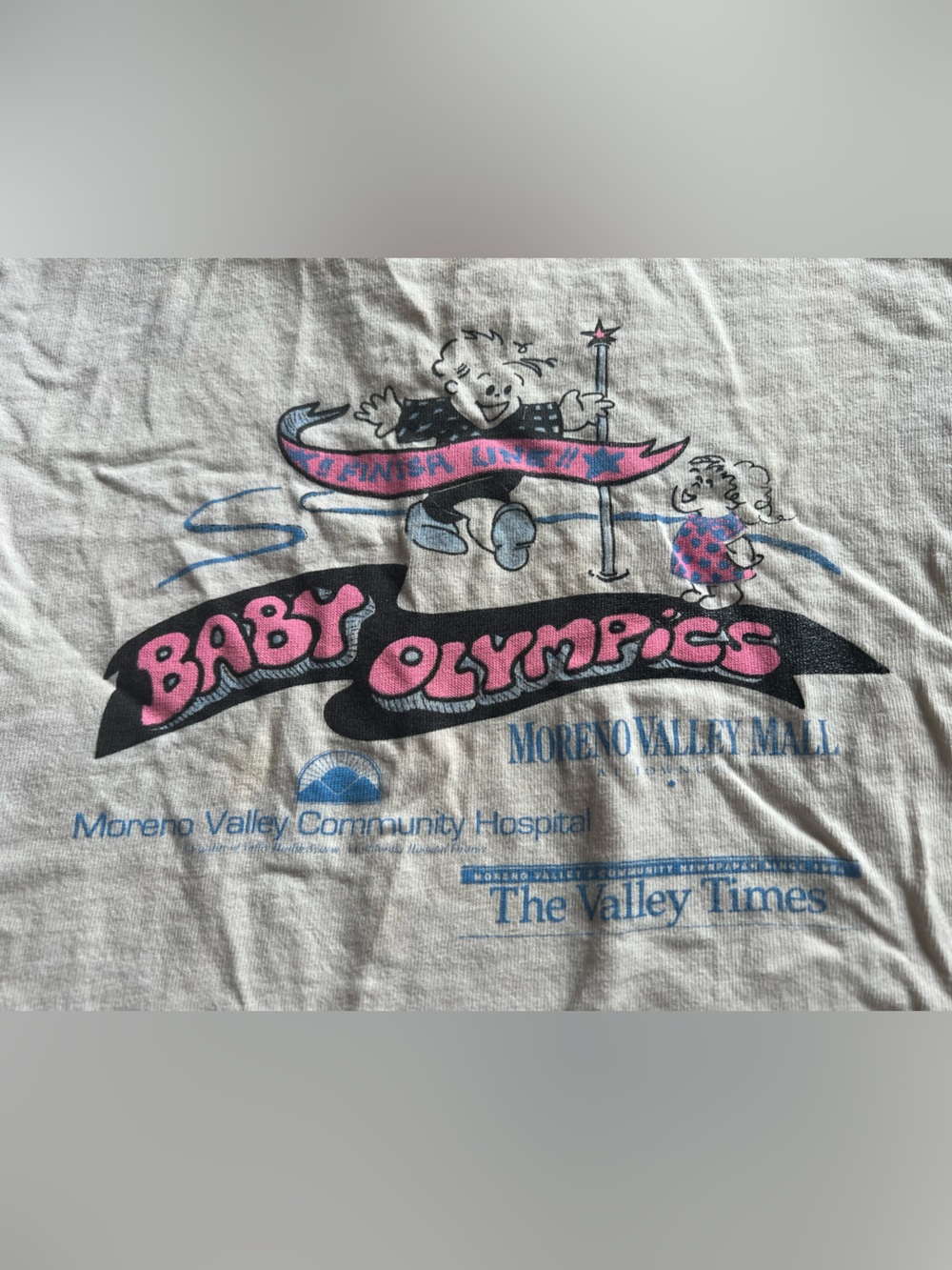 🪄RARE VTG 90’s Neon Baby Olympics white t shirt Moreno Valley Inland Empire